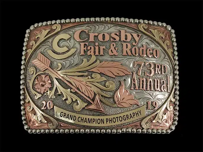 Engraved, Frosted, and antiqued 3-tone trophy buckle with feathers & arrow